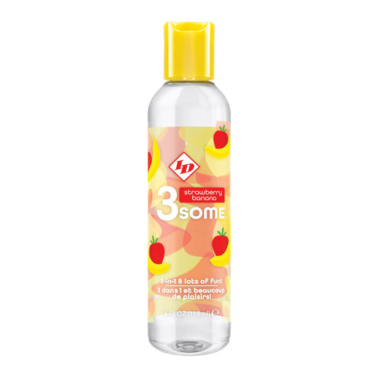 The clear bottle with a yellow cap from ID Lubricants features colorful labels with strawberries and bananas, reading 3some and strawberry banana. Its a 3-in-1 Delight: 3 lots of fun! offering sensual, fruity flavors for playful moments.