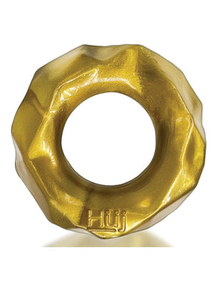 A golden, metallic donut-shaped ring with a wavy edge and central hole, made of Plus+SILICONE and embossed with Hüj, reflecting Hunky Junks design style. This is the Hunky Junk Fractal Cockring by Hunky Junk.