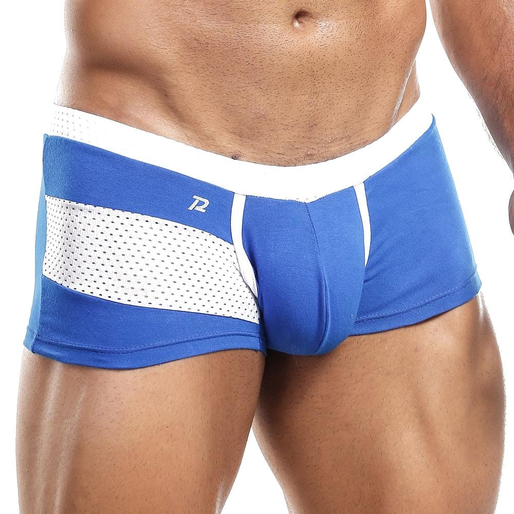 Someone wearing Pistol Pete Boxer Trunk in blue and white with side mesh panels. These trunks feature a supportive pouch, sleek white waistband, and a small logo on the left. The focus is on the lower torso and upper legs.