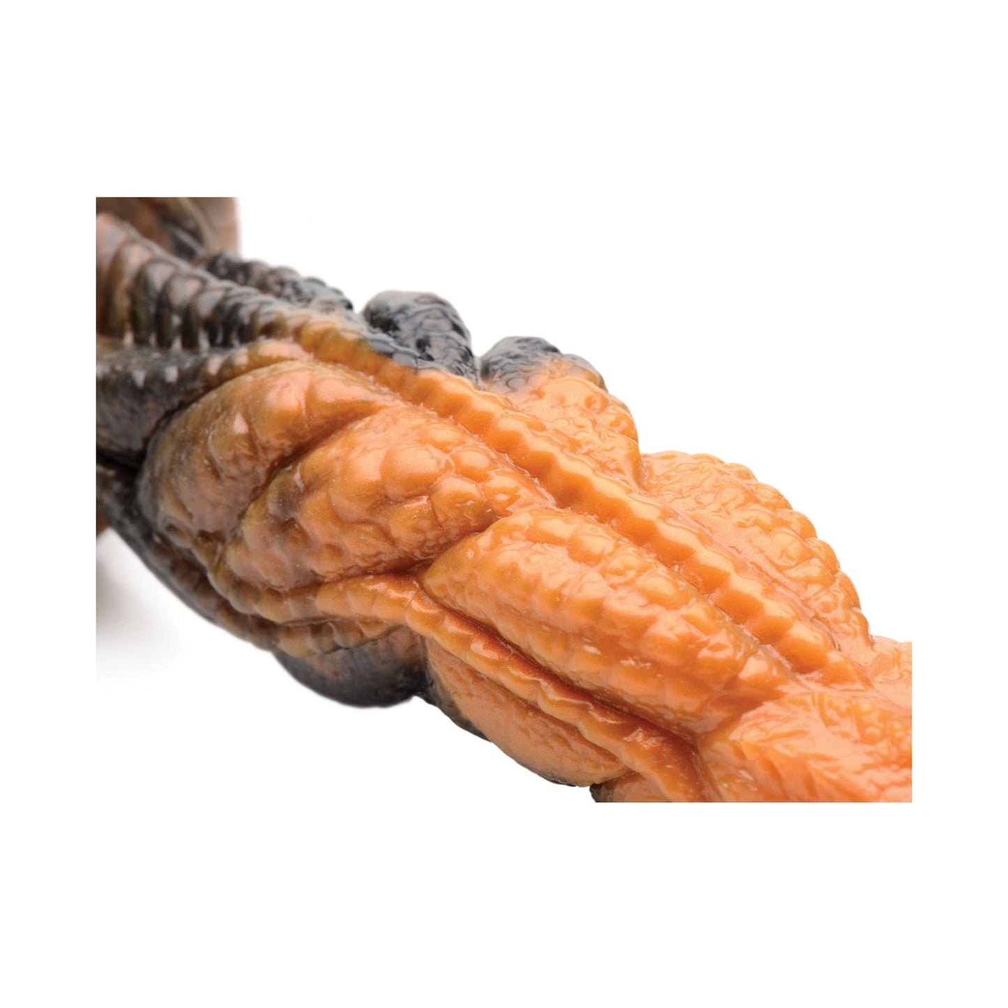 Close-up of a twisted, bumpy Creature Cocks Ravager Rippled Tentacle Silicone Dildo in orange and dark hues. Its textured surface with ridges and grooves resembles a natural form, set against a plain white background.