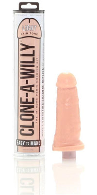 The Clone-A-Willy Kit - Vibrating by Empire Labs lets you create a vibrating penis replica in light skin tone with body-safe silicone. The packaging and the detailed replica are shown in the image.