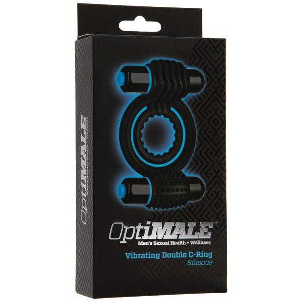 The OptiMALE Vibrating Double C-Ring packaging in black and blue features the product image and brand name, Adams Toy Box, and promotes Mens Sexual Health + Wellness. This silicone cock ring promises enhanced pleasure with dual vibrators for long-lasting erections.