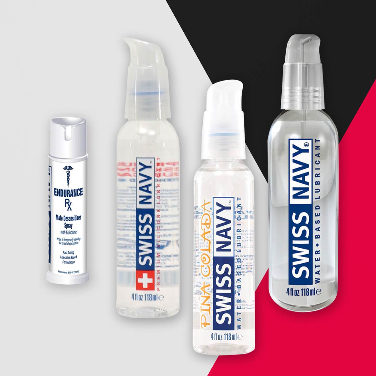 The Swiss Navy Essential Pack, featuring four bottles of Swiss Navy lube and endurance enhancer, stands out against a geometric gray, black, and red background. Each bottle showcases its unique label detailing type and usage for diverse needs.