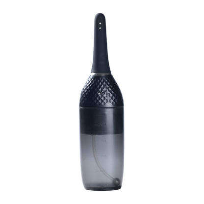 The Auto Bulb Auto Spray Enema by Honey Play Box is a sleek black and transparent portable vacuum cleaner, featuring a textured grip handle and measurement markings on the lower compartment. Its designed for efficient cleaning of small spaces.