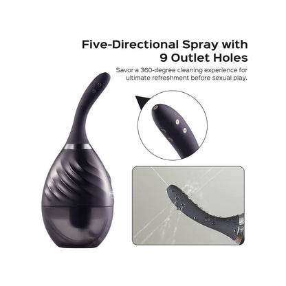 The Honey Play Box Bulby Auto Spray Anal Douche System is shown in black with a sleek spiral design. It features a five-directional spray with nine outlet holes, as seen in the inset. Adjustable spray speeds are demonstrated as water sprays from the nozzle, highlighting its innovative function.