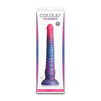 The image features the packaging for a 9-inch Colours Stacked Dildo by NS Novelties, crafted with high-quality liquid silicone in a blue to pink gradient. The box displays the brand name and product details, highlighting its availability in multiple sizes.