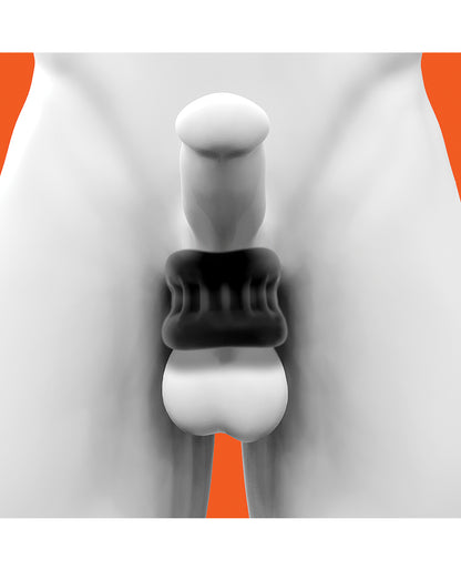 Oxballs Core ball stretcher in Black Ice worn on a white model, pulling the balls down