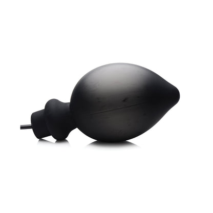 The Master Series Ass-Pand Inflatable Silicone Anal Plug by Master Series is a matte black, pear-shaped plug crafted from body-safe silicone with a nozzle. It has a slightly textured surface and rounded tip, designed for personal hygiene use to ensure safety and comfort.