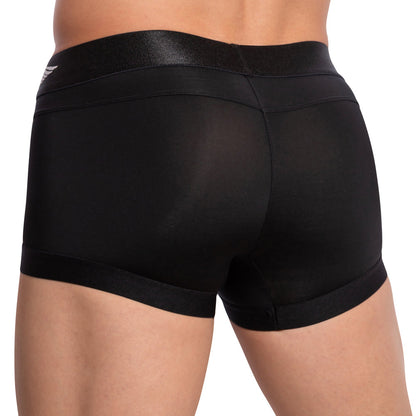 A person showcases the sleek design of the Agacio Armor Boxer Trunk, wearing it with their back facing. The black material offers exceptional comfort with a smooth texture and shiny waistband, set against a plain white backdrop.