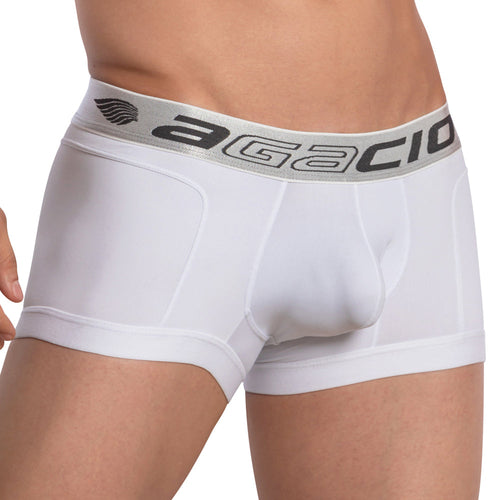 A person wearing Agacio Armor Boxer Trunk, showcasing the wide waistband with Agacio in gray lettering. The focus on the midsection emphasizes design and comfort, highlighting how these white trunks deliver both style and an impeccable fit.