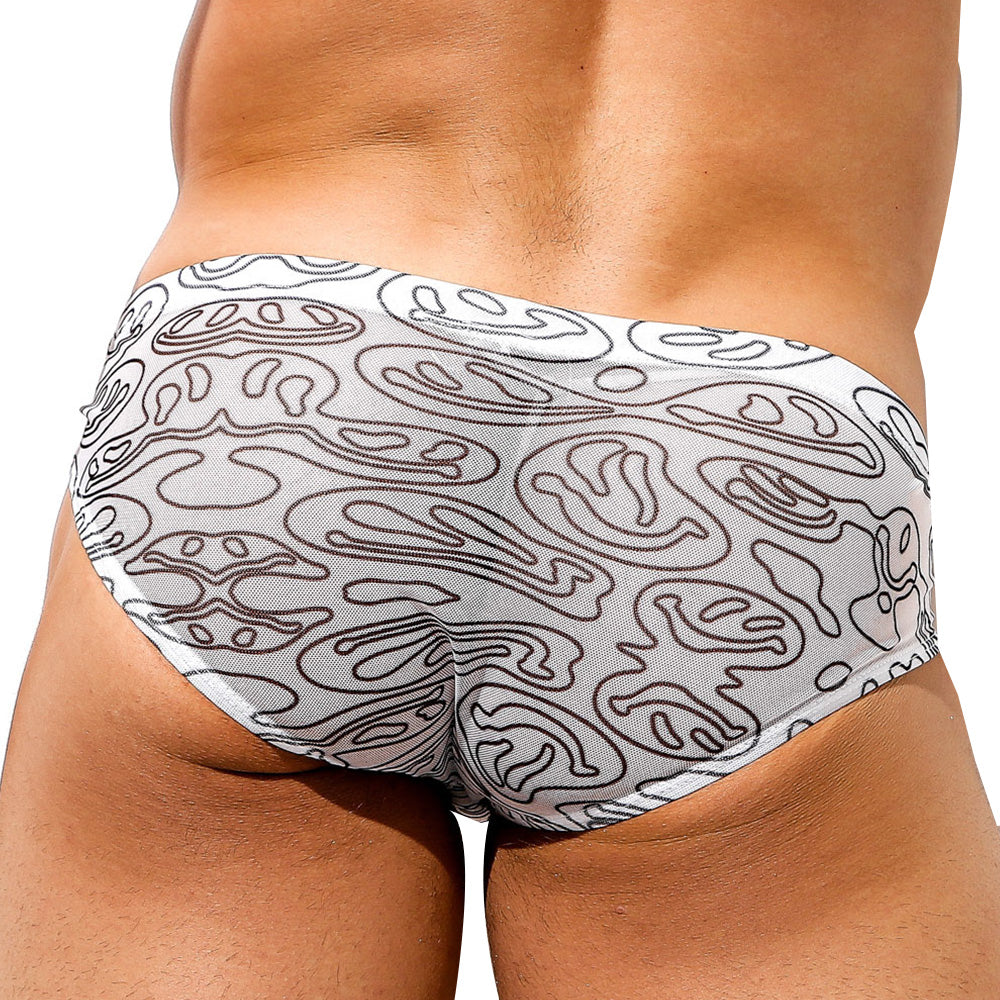 A person is wearing Intymen Distortion Briefs, featuring eye-catching prints and abstract black line designs on a white background. The sheer side panels create allure by highlighting the lower back and upper thighs.