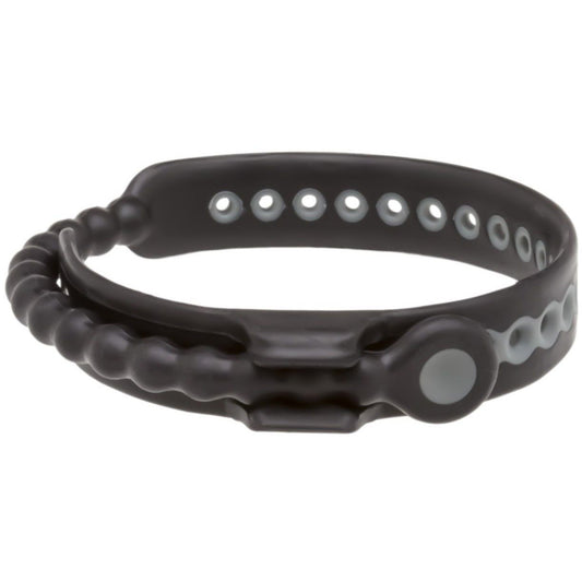 The Perfect Fit Speed Shift 17 Adjustments Cock Ring, a sleek black silicone wristband with a bead-like design and multiple button holes for adjustable sizing, offers long-lasting pleasure while laid flat on a pristine white background.