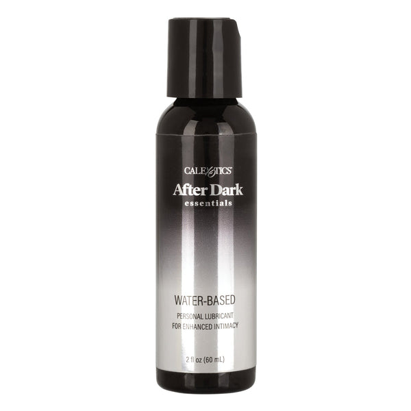 A sleek 2 oz bottle of California Exotic Novelties After Dark Essentials Water Based Personal Lubricant, ideal for sensitive skin. The black-to-silver top and white text underscore its fragrance-free formula for enhanced intimacy.