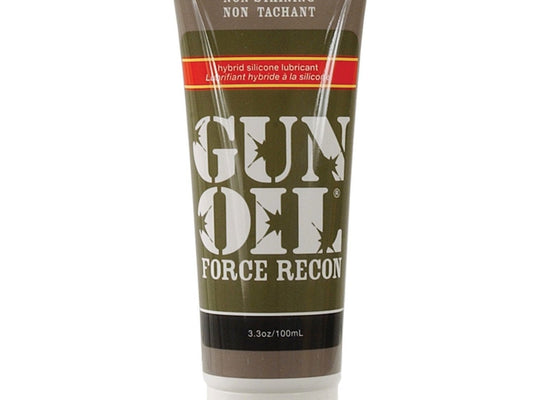 The Gun Oil Force Recon Silicone & Water Based Hybrid Lube, ideal for anal play, is showcased in a 3.3 oz (100 ml) tube with a brown and olive design. The label highlights its specialty hybrid silicone formula and non-staining properties.