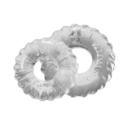 Intertwined clear glass loops with textured edges against a white background resemble decorative rings or abstract art. This design concept mirrors the innovative Skinflex TPR in Oxballs TruckT Cock & Ball Ring - Pack of 2, enhancing flexibility and durability similar to a cock ring.