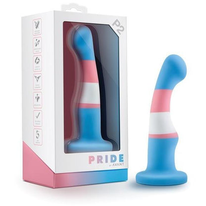 A blue, pink, and white striped silicone toy with a curved design from Blush Novelties is beside its Pride by Avant packaging. The box highlights features like body-safe material and a suction base. Product: Blush Avant P2 Silicone Plug - Trans Pride.