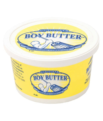 A white and yellow Boy Butter Original container features a strong figure churning butter, with Original above and Personal Lubricant below. Enhanced with coconut oil, this 8 oz product offers a unique variation on traditional silicone lubricants.