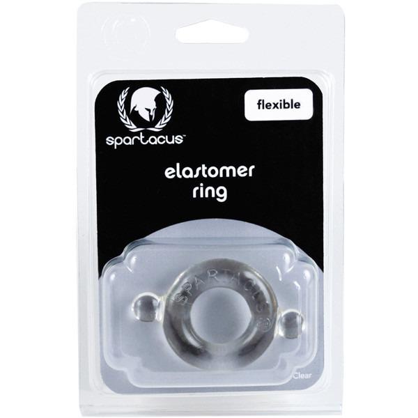 The packaging for Adams Toy Box Elastomer Cock Ring Clear is labeled flexible. The circular product promises firmer erections, visible in transparent plastic against a black background, with the brand logo prominently above.