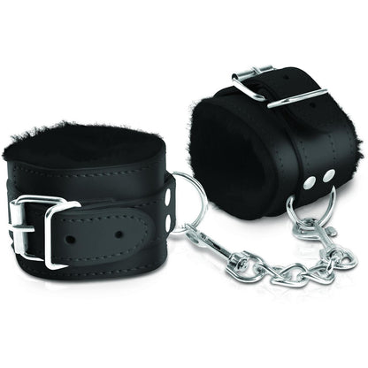 Introducing the Fetish Fantasy Limited Edition Cumfy Cuffs: black leather bondage cuffs featuring a soft interior lining for comfort, connected by a short metal chain and clips. Ideal for exploring your fantasies with restraint and ease.