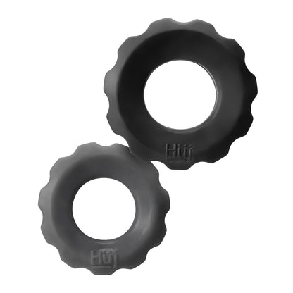 Two black rubber objects resembling Hunky Junk Cog Ring 2 Size Double Pack are on a white background. Made from plus+silicone TPR/silicone blend, each has scalloped edges and features Huf logo embossing.