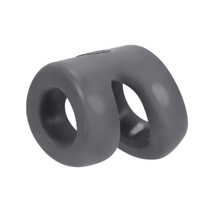 The Hunky Junk Connect Cock Ring w/Balltugger by Hunky Junk is a small, smooth gray silicone ring with two connected loops, designed for wearable use. Made from flexible plus+silicone, it boasts a matte finish for comfort and durability.