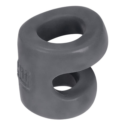 The Hunky Junk Connect Cock Ring w/Balltugger by Hunky Junk is a rubber chew toy with two oval openings, a smooth curved surface made from Plus+Silicone, and an embossed logo. Its compact design in sleek dark gray makes it perfect for playful tugging.