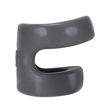 A matte black rubber cable clip with a curved design and an open slot for holding cables, the Hunky Junk Connect Cock Ring w/Balltugger by Hunky Junk is made from plus+silicone, organizing and securing wires with a smooth finish and minimalist appearance.