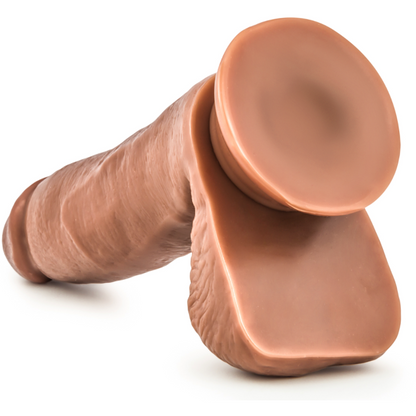 The Loverboy 5.5 Manny by Loverboy is a brown, silicone toy resembling a hammer, displayed on a white background. Its body-safe with a lifelike design, featuring a soft, rounded handle and smooth, flat surface on one end.