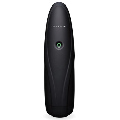 The ZOLO Zeppelin by Zolo is a sleek black airship replica with a glossy, phthalate-free finish. It boasts a circular green accent near its center, embodying a minimalist, modern design that blends innovation and style, resembling a small tech-inspired sculpture.